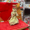 Wooden deity idol figurine of Isar ji, seated pose with ornate gold crown and jewelry.