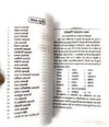 Open Hindi book pages with printed text in two columns