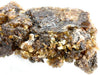 Incense dhoop resin chunk with dark gray base and yellowish crystals