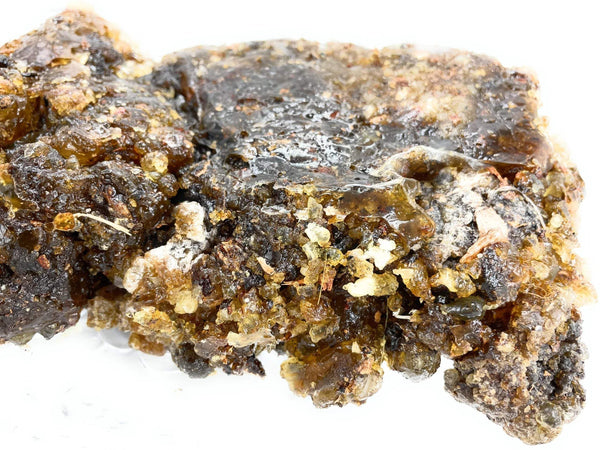 Incense dhoop resin chunk with dark gray base and yellowish crystals