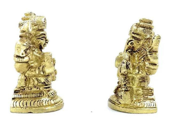 Small Ganesh-Laxmi idol in gold tone, seated deity with detailed crown and raised hands