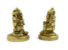 Pair of gold-tone deity figurines in side view, seated on round bases