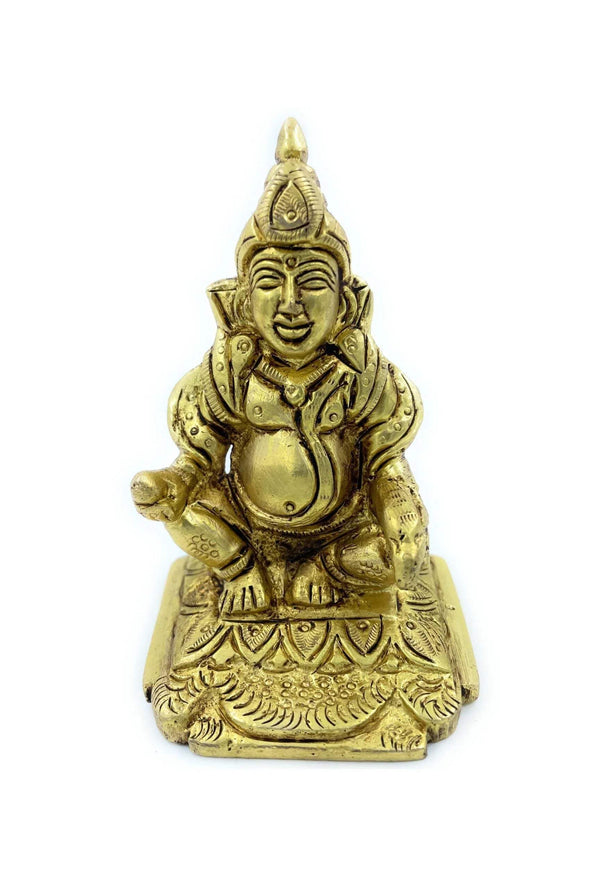 Gold-tone seated Kuber statue with ornate crown and layered robe details