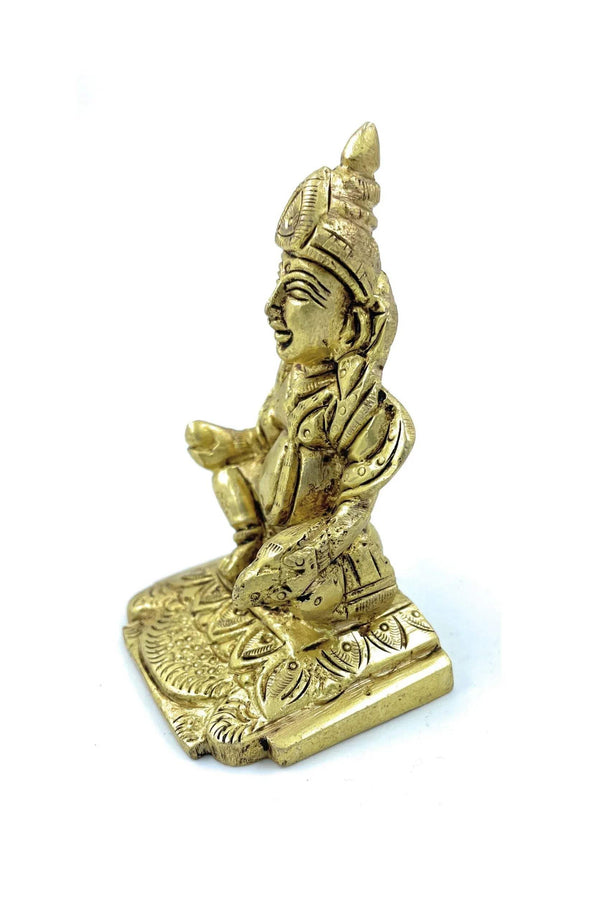 Gold-tone standing Kuber statue with folded hands and detailed draped clothing