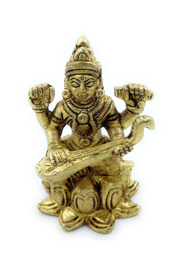 Golden Saraswati figurine with veena, seated cross-legged and holding instrument