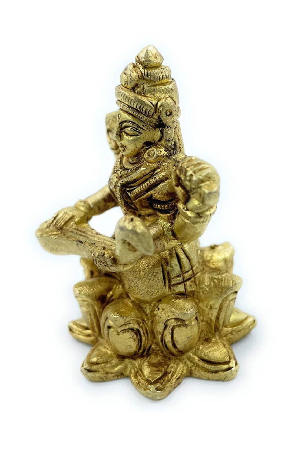 Golden Saraswati figurine side view, arms raised and veena details on seated base