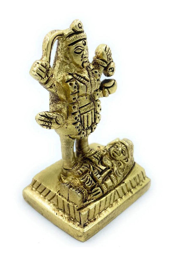 Gold-tone Kali goddess idol figurine, angled view with raised right hand on pedestal