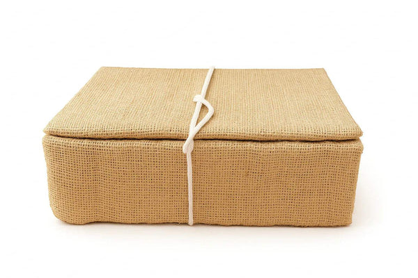 Tan jute idol care box with white tie closure, rectangular