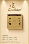 Gold yantra card with measurement diagram showing 2 in size