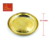 Round brass tray with raised rim and smooth reflective surface