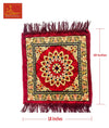 Velvet pooja mat in burgundy with central rosette mandala, patterned border, tassel fringe