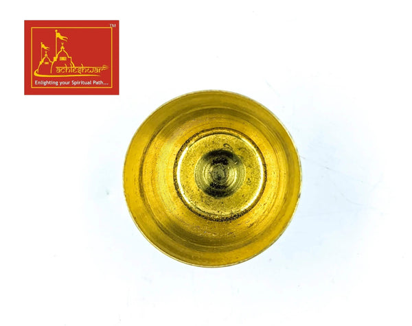 Gold-tone round plate with raised center and concentric detailing