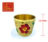Meenakari brass bowl with red and green floral motif on textured exterior