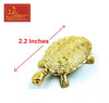 Gold tone turtle charm with textured geometric shell detail and raised legs