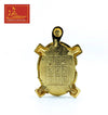 Gold tone turtle charm with top loop and stamped number marks on front