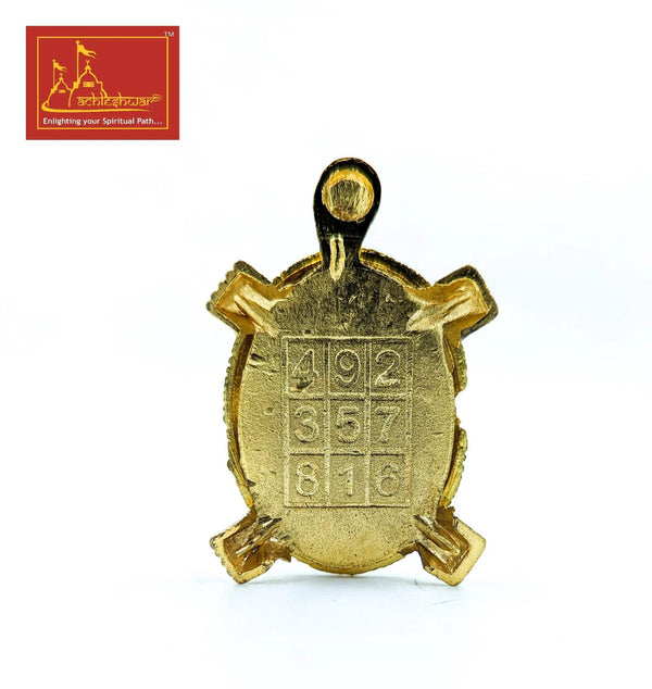 Gold tone turtle charm with top loop and stamped number marks on front