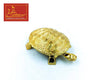 Gold tone turtle charm with raised shell pattern and small leg and tail details