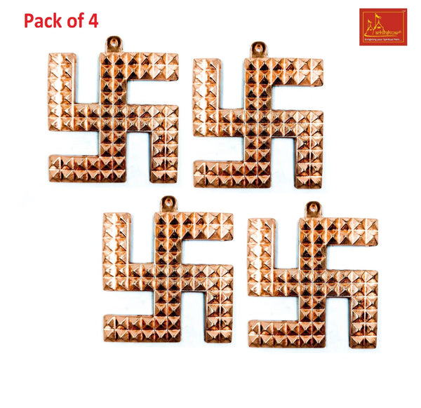 Four copper swastik pyramid ornaments with raised pyramid texture and hanging loops