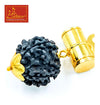 Rudrakhs pendant close-up: dark blue textured bead with gold cap and loop