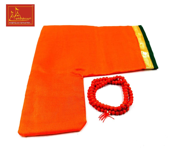 Orange fabric pouch with red mala beads loop and tassels, folded cloth with gold edge