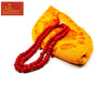 Red bead mala with carved beads and orange-gold fabric pouch with printed symbols