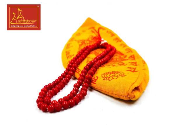 Red bead mala with orange-gold fabric pouch and printed symbols