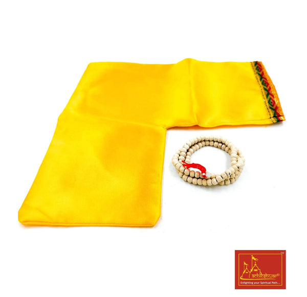 Yellow cloth pouch with gold trim and white tulsi mala beads