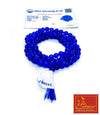 Blue agate mala bead necklace with white tag and blue tassel, coiled loop