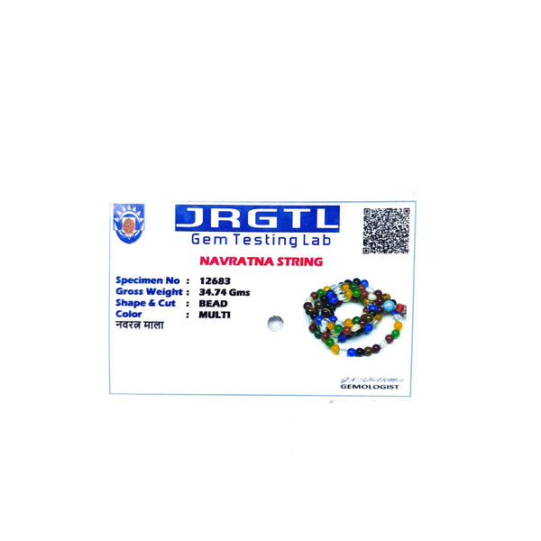 Multicolor bead mala shown on a gem testing label card