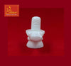 White marble shivling idol with rounded base and wrapped arm-like side details