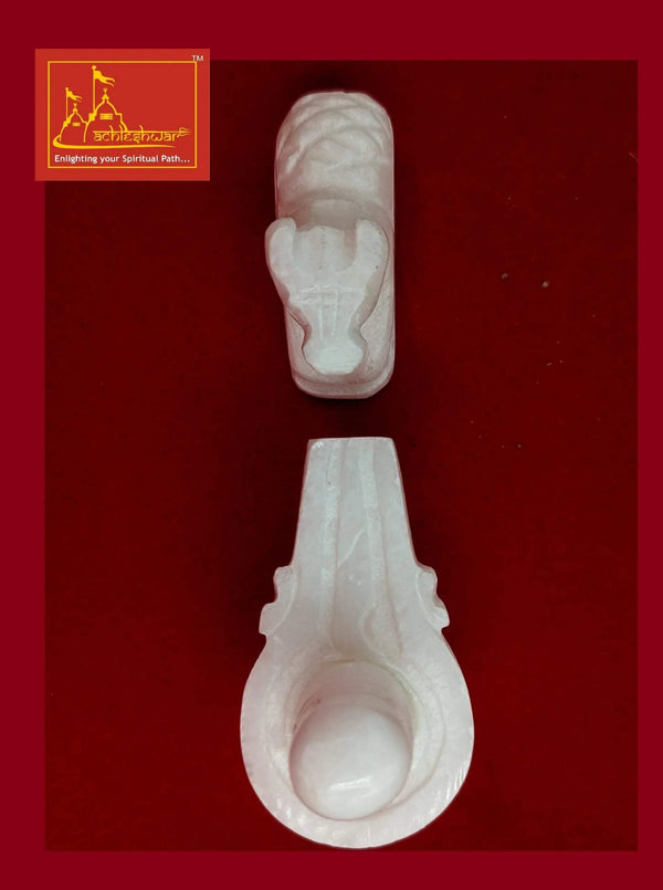 White marble Nandi and Shivling figurines, close angled view of each piece