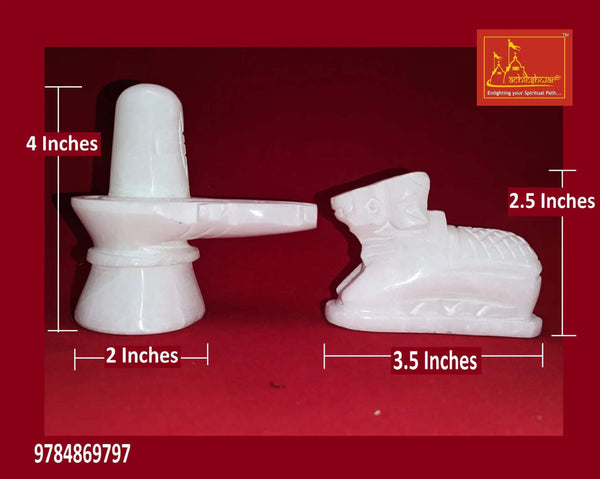 White marble shivling with Nandi statue beside it, rounded base and smooth detailing