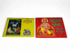Two Hanuman prayer books, yellow and red covers, shown side by side