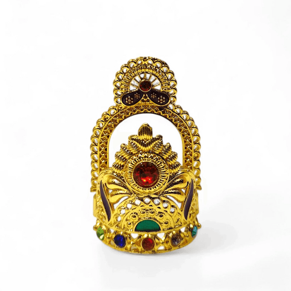 Gold-tone mukut crown with ornate filigree and round red gemstone at center