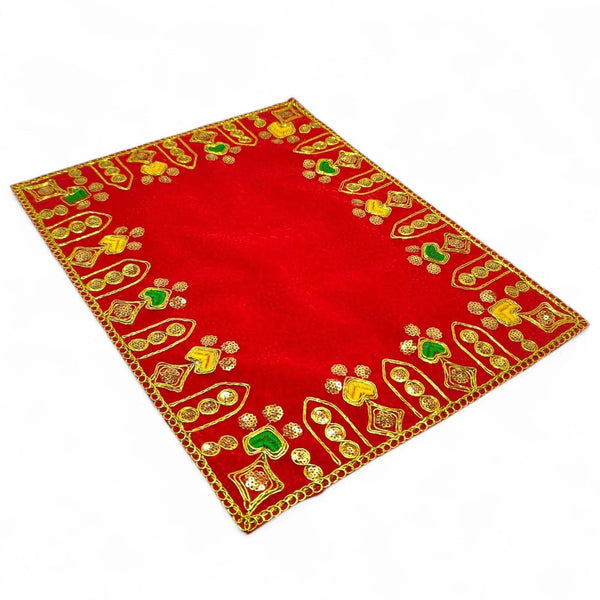 Red velvet pooja aasan cloth with gold embroidered border and decorative deity motifs