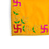 Close-up of yellow pooja velvet chowki aasan corner with embroidered multicolor motifs