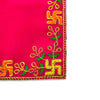 Pink velvet pooja asan corner with green leaves and golden embroidered motif.