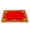 Red pooja aasan cloth with golden border and green floral motifs at each corner