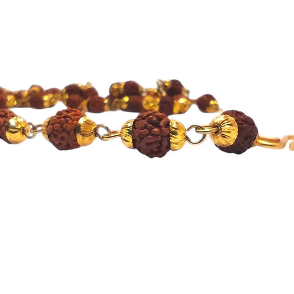 Close-up of Rudraksha bead mala with gold tone caps and brown textured beads