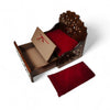 Wooden sofa cum bed with open storage tray, red cushions, and beige insert
