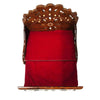 Wooden sofa cum bed with carved backrest and red cushion, back frame view