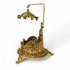 Antique gold singhasan with arched handle, carved seat, and ornate base feet