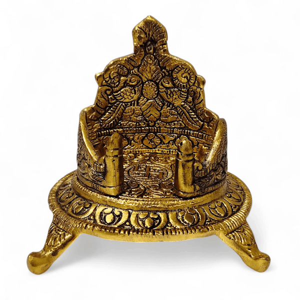 Antique gold singhasan throne close-up with engraved figures and central seat panel