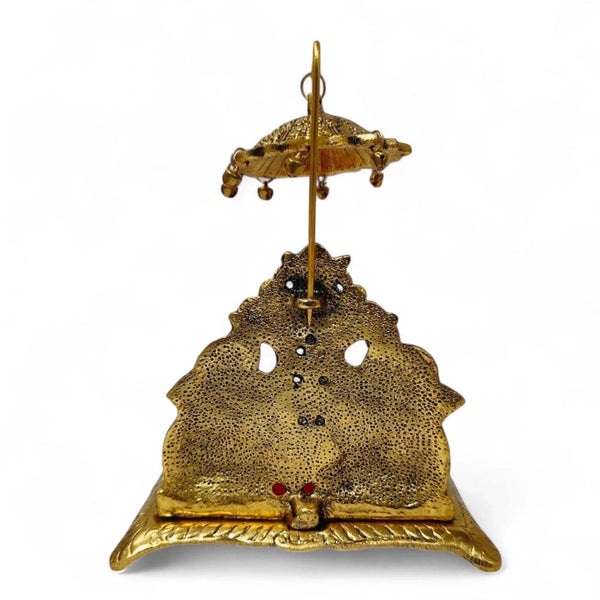 Gold metal hanging elephant throne with red cushion and decorative base