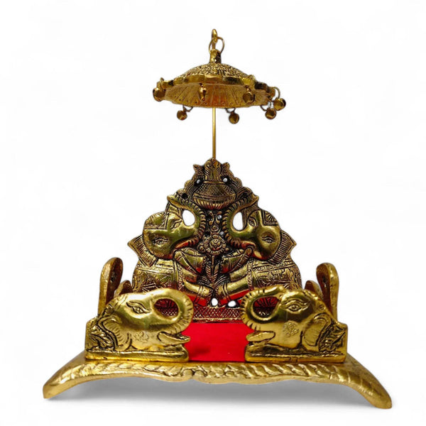 Gold metal elephant singhasan with red platform, central figure and hanging canopy
