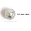 Silver lidded container with embossed design on lid; 4 x 4 cm