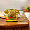 Golden miniature metal telephone toy with gem inlay and gold chain cord