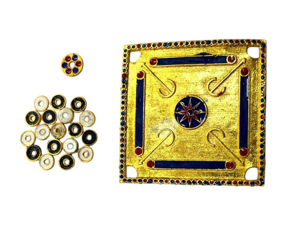 Miniature carrom board with coin pieces and blue-red striker disc