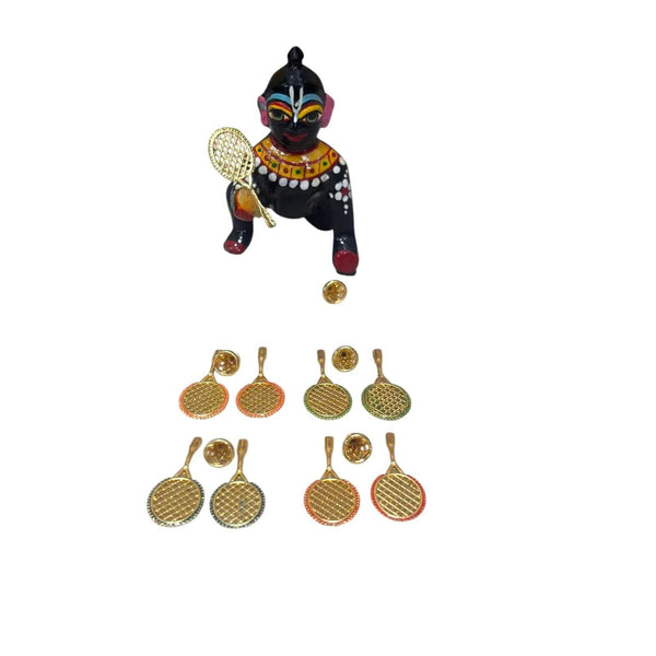 Miniature badminton racket and shuttlecock set with small Krishna figurine, gold rackets