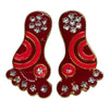 Two Krishna charan toys side-by-side, red and gold with rhinestone details